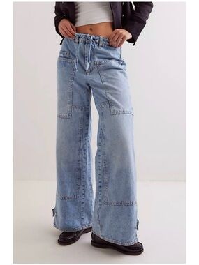 Free People Crvy Outlaw Wide Leg Jeans in a light blue patchwork wash